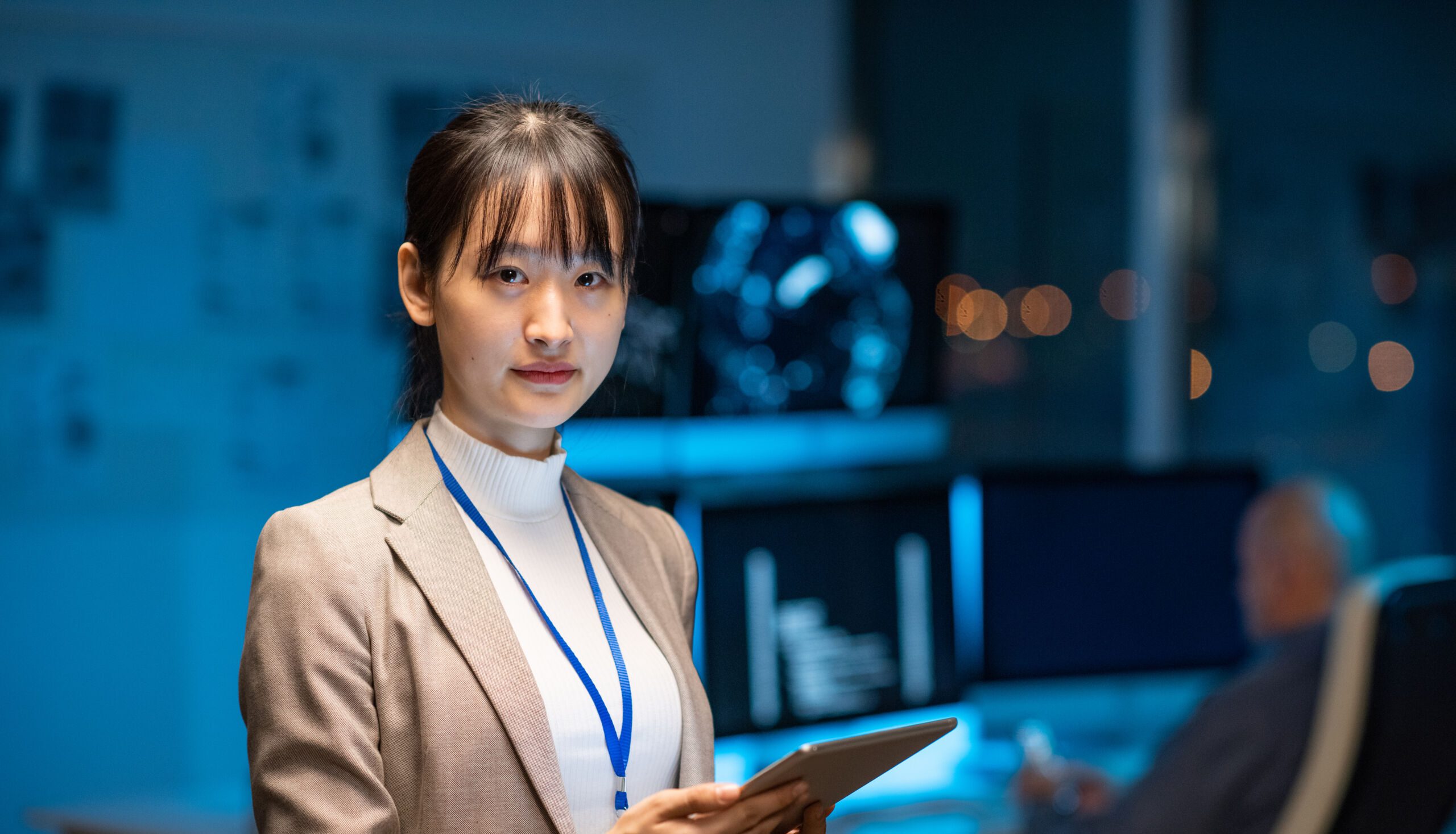 Young serious female programmer or developer in formalwear