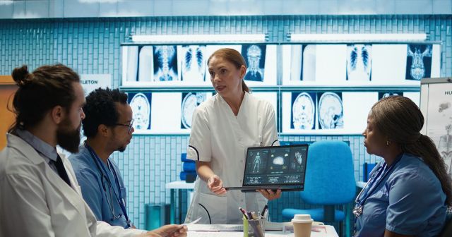 Healthcare worker using AI on a tablet