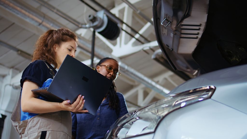 Technician does checkup on client car