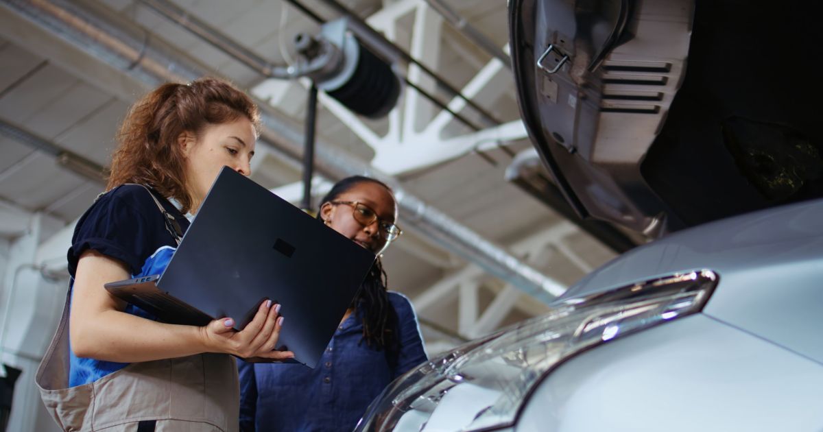 Technician does checkup on client car