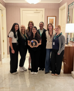 Presidio's marketing team posing with the AWS Marketplace Partner of the Year award.