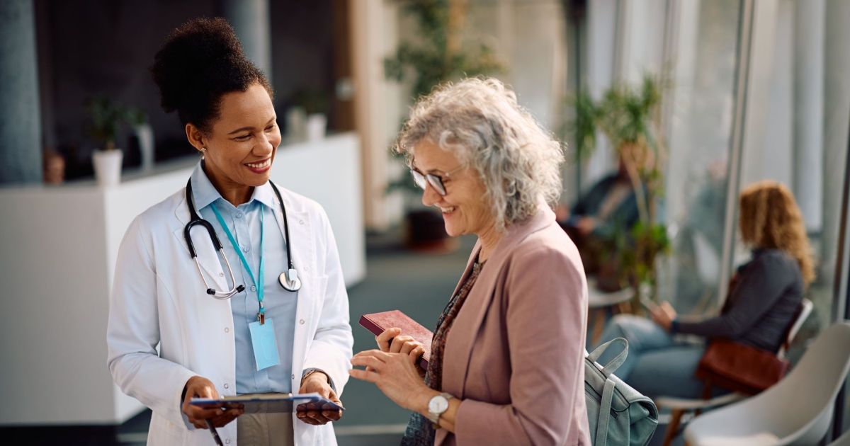 Patient and doctor talking about healthcare with Ipad