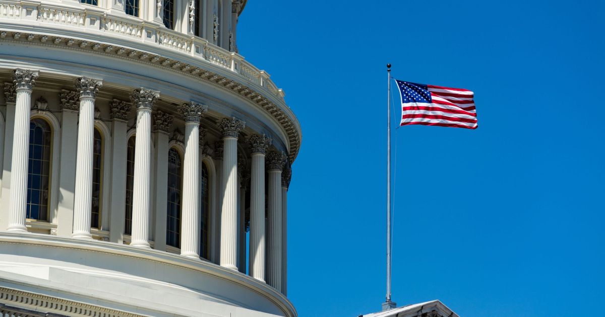 Low angle closeup of The United States Capitol under the sunlight and a blue sky in Washington DC