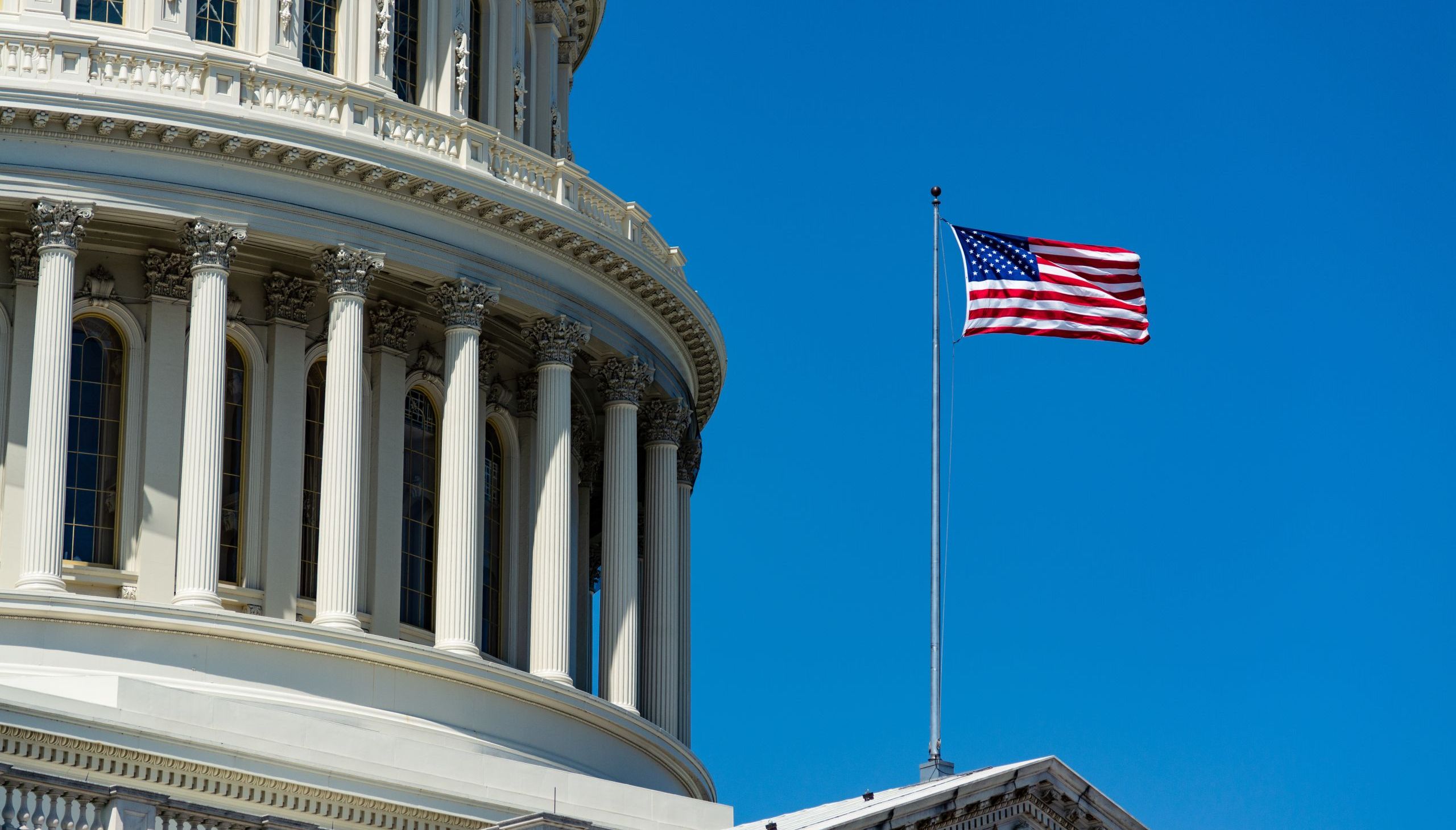 Low angle closeup of The United States Capitol under the sunlight and a blue sky in Washington DC