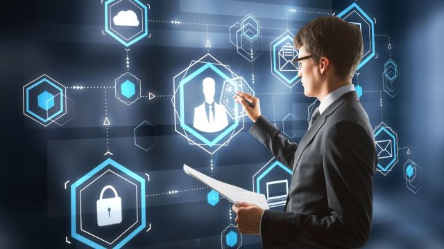 Cybersecurity professional using an abstract screen.