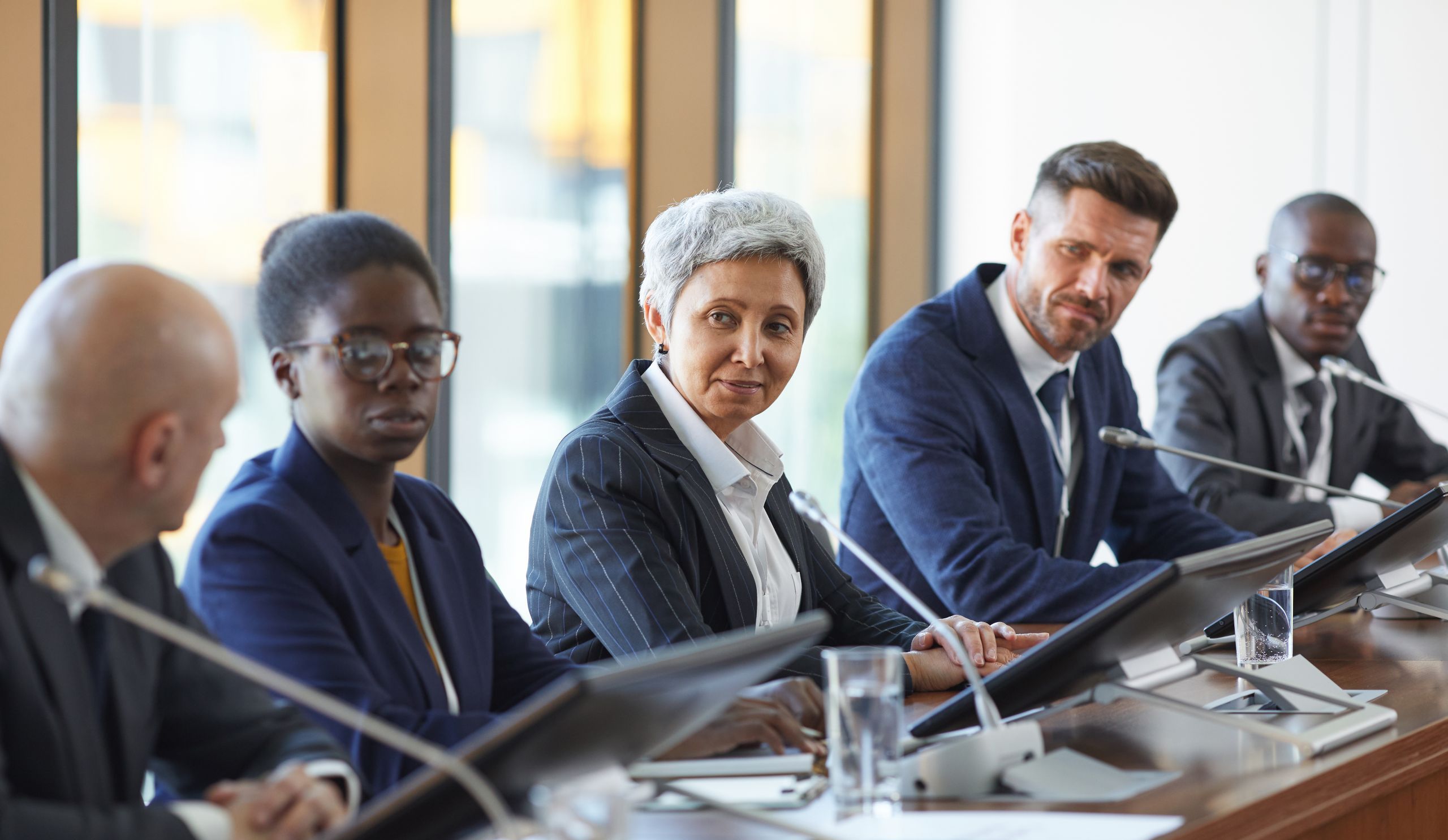 Group of business people discussing new project together in team during meeting at board room