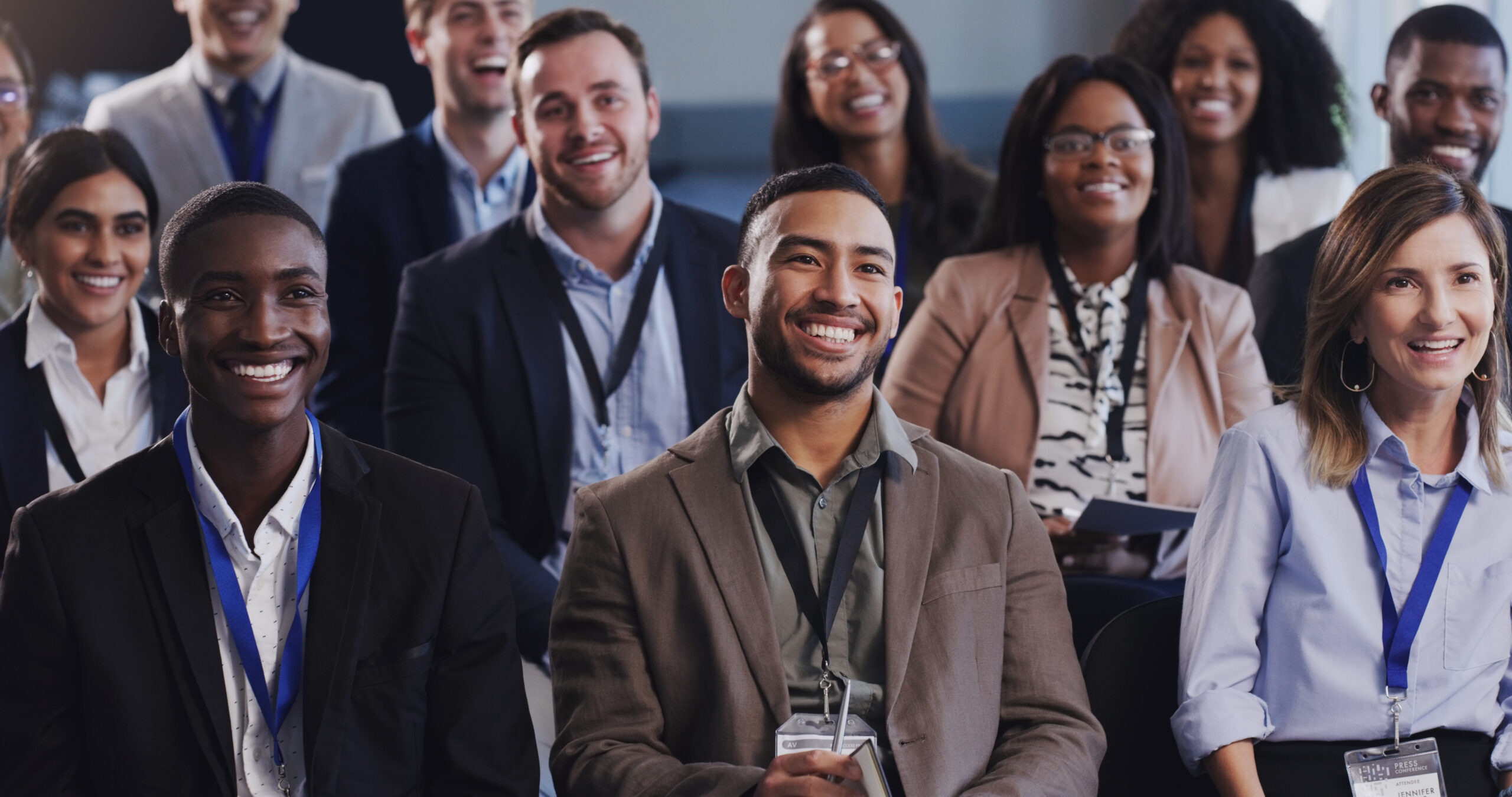 Business people conference and happy audience listening to a seminar workshop or training Diversity men and women crowd at conference or convention for corporate education knowledge and learning
